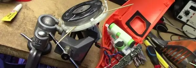 Vacuum cleaner repair parts and tools on a workbench in Tuscaloosa, AL